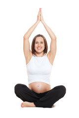 Obraz premium pregnant woman doing yoga
