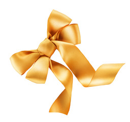 Bow. Golden satin gift bow. Ribbon. Isolated on white