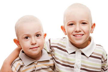 Shaved heads children smiling