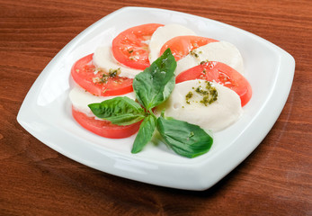 Arrangement of mozzarella and tomatoes