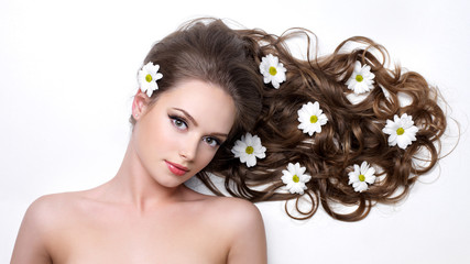 Beautiful woman with long hair in flower
