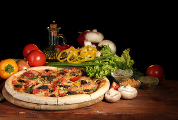 delicious pizza, vegetables and spices
