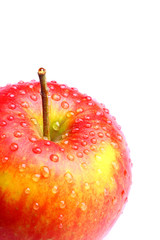 Delicious red apple with water drops