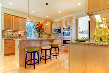 Large luxury maple wood kitchen with island and stools