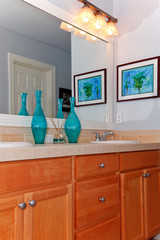 Bathrom sinks and cabinets in golden maple