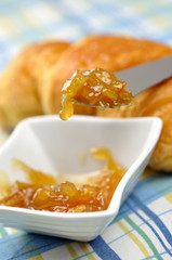 Orange jam and croissant