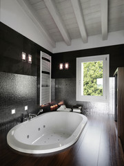 bagno moderno con vasca da incasso in mansarda