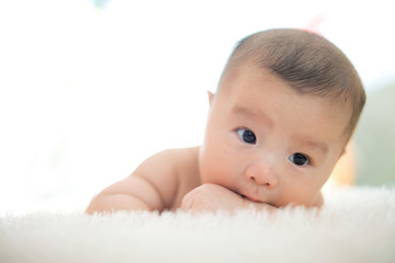 cute baby lie on bed