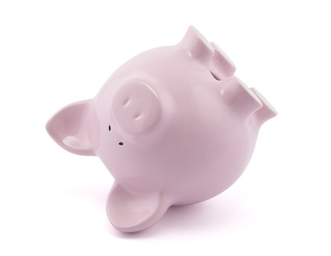 Pink piggy bank upside down. Clipping path included.