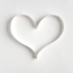 Heart made of paper on white background