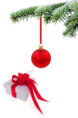 Christmas tree over  gift with red ribbon