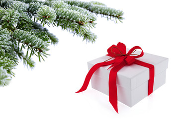 Christmas tree over  gift with red ribbon