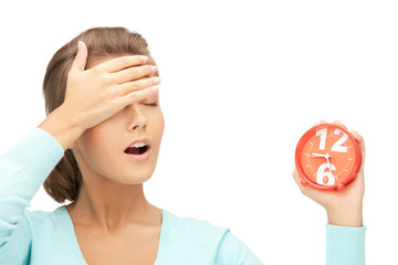 woman holding alarm clock