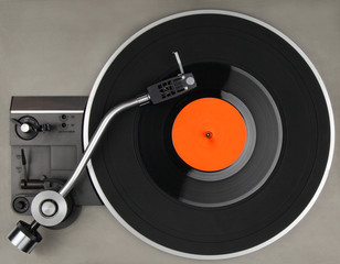Vintage record player with vinyl phonorecord