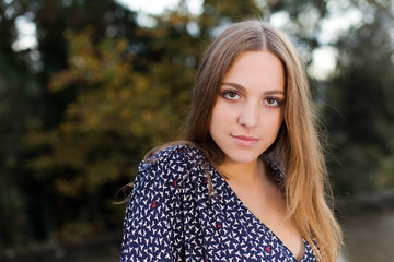 Fototapeta premium Beautiful young woman outdoors portrait.