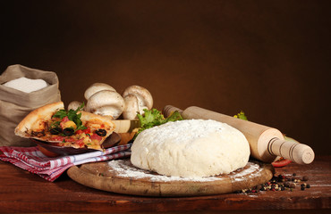 delicious pizza dough, spices and vegetables