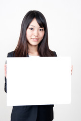 Naklejka premium a portrait of asian businesswoman with whiteboard