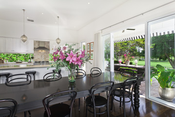 Dining area and kitchen overlooking a golf course