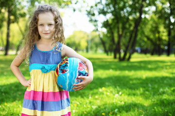 Little girl in summer park