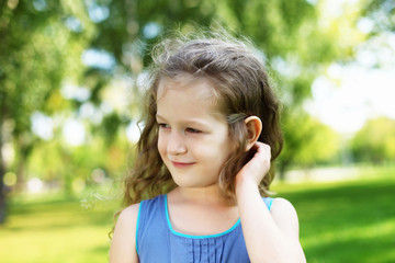 Little girl in summer park