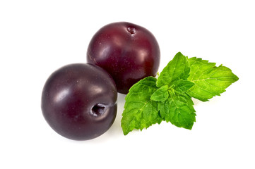 Plums with a sprig of mint
