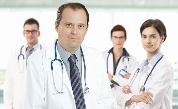 Mid-adult doctor leading medical team