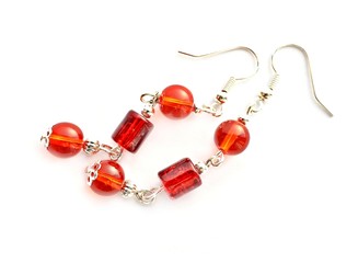 Red earrings on white