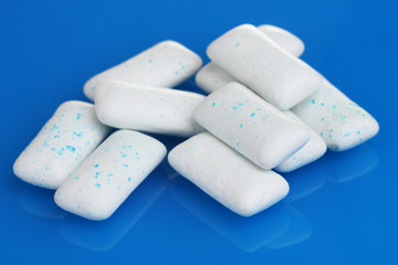 chewing gums on blue background
