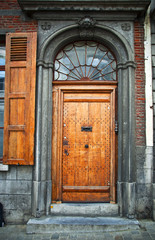 Fototapeta na wymiar Old wooden door in the town of Mons. Belgium.