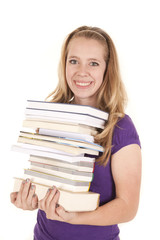 girl stack of books smile