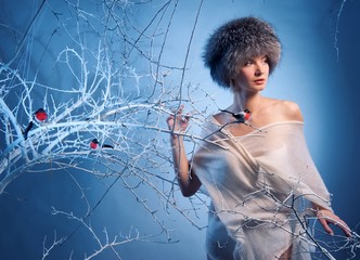 Attractive woman in winter forest