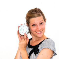 woman holding alarm clock