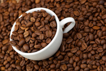 White cup with coffee grains