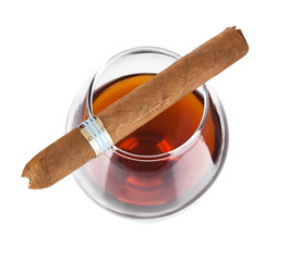 cognac in goblet with cigar isolated on white background