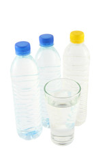 Drinking water in bottles and glass on white background.