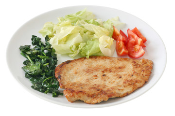 fried turkey with salad and spinach