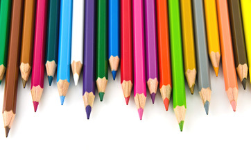Set of colorful color pencil lined in row on white background.