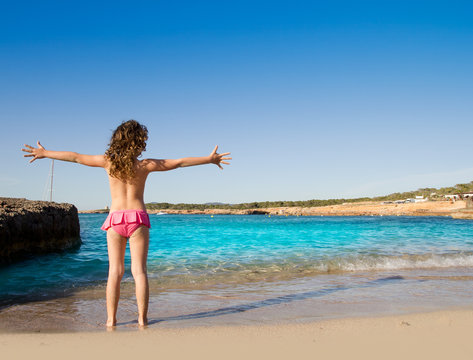 Ibiza Cala Conta beach open arms little girl