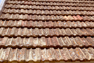 Clay flat roof tiles weathered in Ibiza