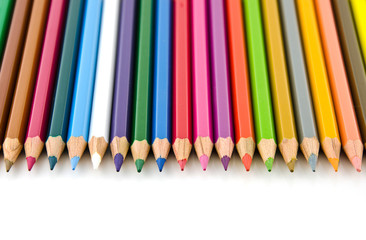 Set of colorful color pencil lined in row on white background.