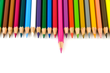 Set of colorful color pencil lined in row on white background.