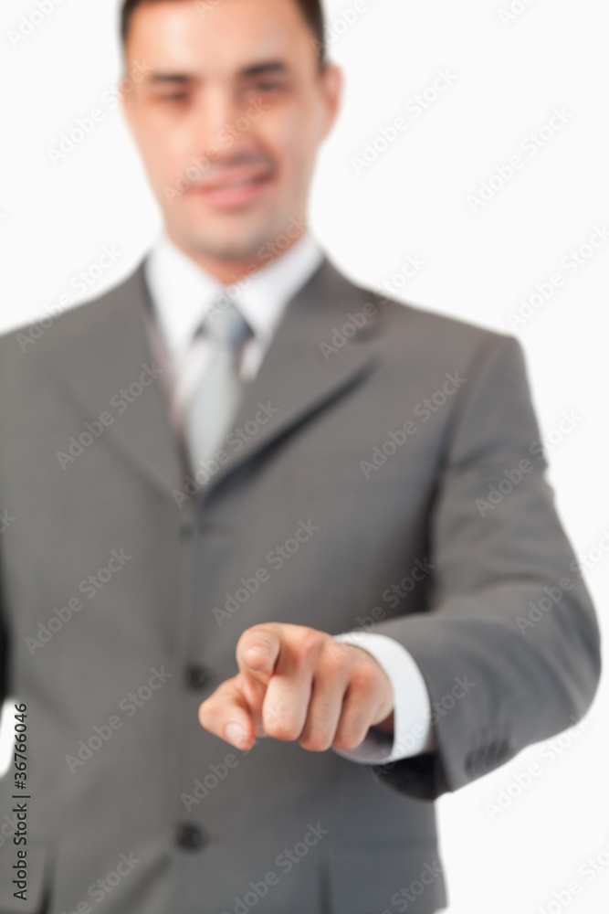 Poster portrait of a businessman pressing an invisible key