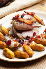 baked pheasant with bacon, pear, raisins on brandy