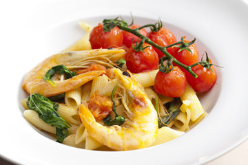 pasta penne with prawns, spinach and grilled cherry tomatoes