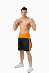 Fototapeta premium Young boxer with bare fists up
