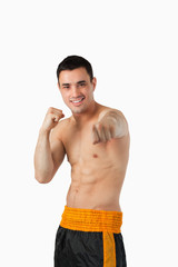 Fototapeta premium Smiling young martial art fighter