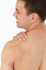 Naklejka premium Young male experiencing neck pain