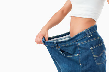 Woman wearing too large pants