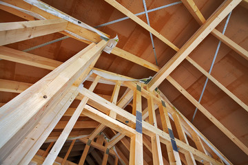 looking up to the roof structure in a modern timber-frame house