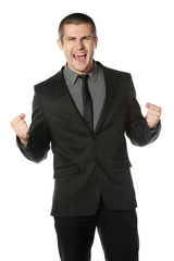 Happy young business man celebrating success